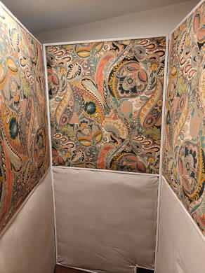 three walls of the booth, attached to form the interior of the booth. No desk or computer or recording equipment has been added.