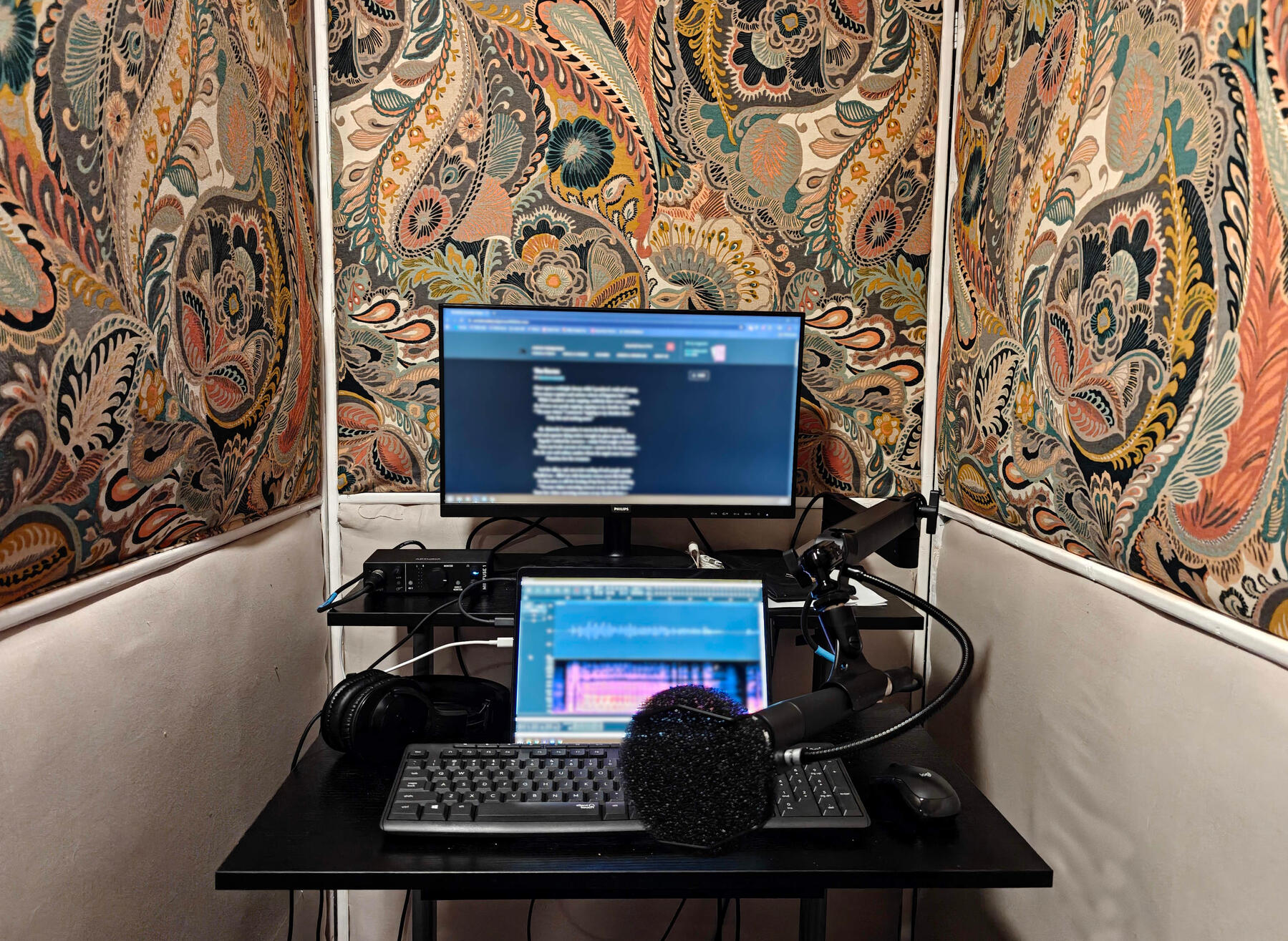 recording booth a photo of AJ Fidalgo's booth. The interior walls are plush.